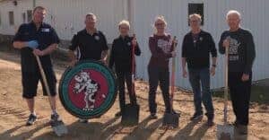 Deadman family standing in front of new ice cream mix plant.