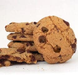 Pile of chocolate chip cookies on a white background