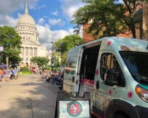 Chocolate Shoppe Ice Cream catering van in front of Madison capital