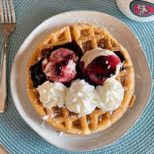 Vanilla waffle sundae with blueberry topping